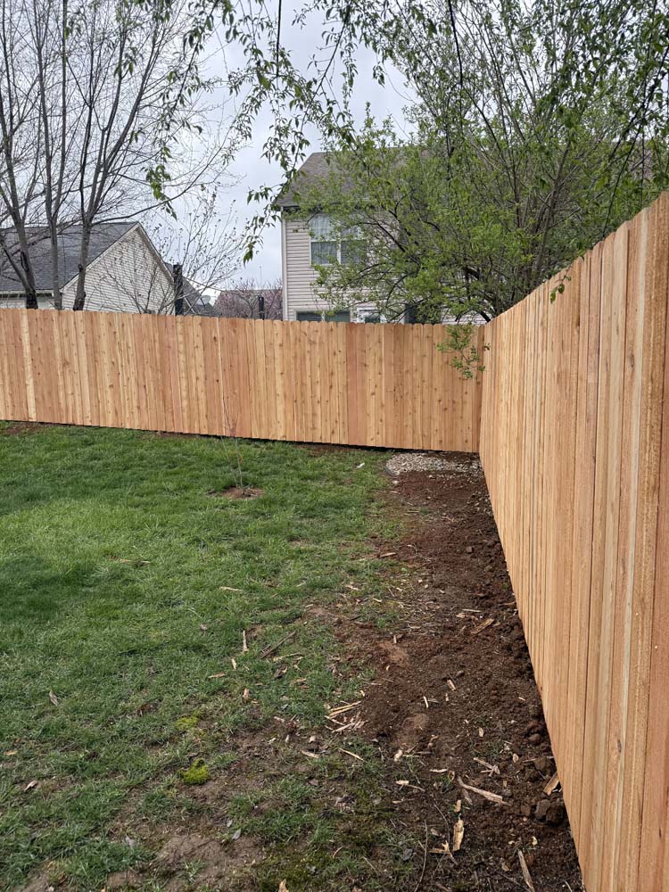 Privacy Fences Built Like They’re Our Own - Roark Fencing Backyard wooden privacy fencing completed by Roark Fencing.