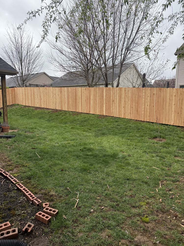 Privacy Fences Built Like They’re Our Own - Roark Fencing Backyard wooden privacy fencing completed by Roark Fencing.