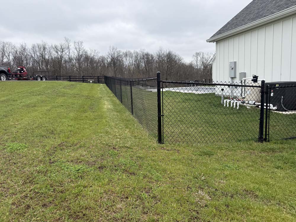 Black chain link fencing completed by Roark Fencing